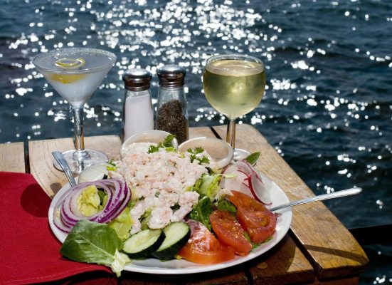 Dinner salad and cocktails by the water